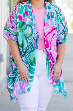 Add a touch of style and flair to your summer outfits with our We're On Our Way Kimono! The perfect layering piece, it comes in a stunning green-pink color and will elevate any look! Say yes to effortless, chic style with this must-have addition to your wardrobe! 100% Polyester V-neck Cover-up For Spring/summer Outings, Tropical Cover-up For Spring Day Out, Spring Brunch Cover-up With Short Sleeves, Trendy Spring Beach Cover-up Tops, Chic Multicolor Spring Cover-up, Green Floral Print Summer Cover-up, Flowy Short Sleeve Spring Cover-up, Casual Tropical Print Cover-up For Spring, Casual Spring Tropical Print Cover-up