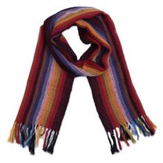 Bring the beauty of an Andean rainbow to your wardrobe with this scarf from Peru. Designed and handwoven of 100% alpaca by the talented artisans of the Ulloa Family the soft scarf features bright multicolored stripes along its length completed at the ends with fringes. Handwoven Wool Scarves For Winter, Wool Handwoven Winter Scarves, Winter Wool Handwoven Scarves, Bohemian Hand Knitted Alpaca Scarves, Handwoven Alpaca Scarves For Fall, Fall Alpaca Handwoven Scarves, Fall Handwoven Alpaca Scarf, Bohemian Handwoven Alpaca Scarves, Handwoven Alpaca Winter Scarf