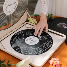 a record player with handwritten notes on it