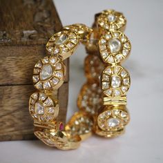 Uncut polki kundan bangles beautiful and elegant for your festive season Uncut Bangles, Polki Bangles, Unique Bangle, Kundan Bangles, Sabyasachi Jewellery, Jewel Wedding, Antique Jewelry Indian, Pearl Jewelry Wedding, Bridal Bangles