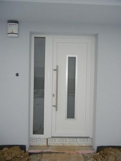 a white door is in the corner of a room