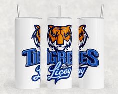 two white tumblers with tigers and blue lettering on the front one has an orange tiger's head