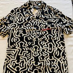 Keith Haring Casual Short Sleeve Button Down New With Tag Authentic And Licensed Merchandise Released By H&M Regular Fit Left Front Pocket 100% Viscose Feels Very Soft And Silky Light And Cool Material Please Choose Between Xs, S, M, L, Xl Or Xxl ***Completely Sold Out At Stores And Online*** Price: Firm (No Offers Please) Casual White Johnny Collar Short Sleeve Shirt, White Top With Button Closure And Camp Collar, White Fitted Casual Camp Shirt, White Fitted Camp Shirt With Camp Collar, Casual Fitted Shirt With Camp Collar, Fitted Casual Shirt With Camp Collar, Summer Tops With Graphic Print And Johnny Collar, White Graphic Print Button-up Tops, Casual Fitted Shirt With Johnny Collar