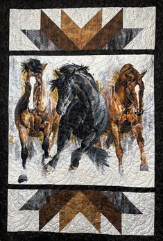 three horses running in the same direction on a quilt