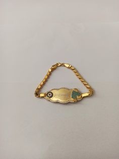 Color: gold Length: 1.7 Width:16cm Material: 925 Sterling Silver 925 carat baby bracelet is of very high quality. It will look great on your baby's wrist. Evil eye bead and turquoise stone footprint look very nice on the bracelet. there will be a pink footprint for baby girls. You can get it as a gift for a baby you love or your own baby ♥ ️ ♥ ️ ♥ ️ Personalized new baby name jewelry. New baby jewelry that you can print your baby's name. You can also buy it as a gift for your own baby or your fa Silver 14k Gold Nameplate Bracelet, Gold Hypoallergenic Name Bracelet For Anniversary, Gold Name Bracelet With Birthstone In 14k Gold, Gold Name Bracelet With Hallmark For Gifts, Gold Name Bracelet With Hallmark As Gift, Yellow Gold Nameplate Bracelet For Birthday, Gold Nameplate Jewelry With Birthstone, Gold Name Bracelet With Birthstone For Anniversary, Gold Nameplate Bracelet For Birthday