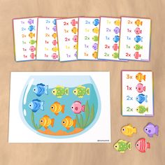 an image of children's counting game with fish in the water and numbers on it