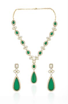 This modern interpretation of late Victorian art is a masterpiece of elegance and charm. Adorned with intricately cut polkis, cubic zirconia, and mint green crystals, this Necklace Set captures the essence of the period's glory while adding a touch of finery and glamour to any outfit Finish: 22KT Gold Plating Material: Silver, Copper Alloy, Polki Color: Mint Size: Free Size, Adjustable Closure Type: Lobster Box Contains: 1 Necklace, 1 Pair Earrings Elegant Green Diamond Necklace Hand Set, Elegant Green Hand Set Diamond Necklace, Luxury Green Jewelry With Intricate Design, Exquisite Hand-set Green Diamond Necklace, Exquisite Green Diamond Necklace Hand Set, Traditional Green Diamond Necklace For Formal Occasions, Elegant Green Kundan Necklace, Elegant Green Kundan Necklace For Formal Occasions, Fine Jewelry Hand-set Green Diamond Necklace