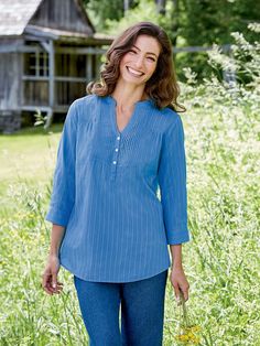 This casual top is cut to fit beautifully and comfortably and features delicate pintucking at the neckline for added polish and endless charm. Additional features include soft gathers at the shoulder, notched neckline with 3 buttons, and 3/4-sleeves with a button cuff that be rolled up and secured with a button tab. Split neckline with pintuck accentsSoft gathers at the shoulders3/4 cuffed sleeves with button tabsApprox. 29" long100% cottonMachine wash and dryImported Tunic Sewing Patterns, Vermont Country Store, Notched Neckline, Linen Blend Pants, Cotton Tunic, Country Store, Women Tunic Tops, Pin Tucks, Womens Tunics