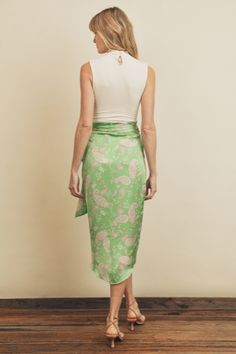 A beautiful satin wrap skirt that belongs at a resort somewhere beautiful. -VINTAGE INSPIRED PAISLEY PRINT -BEAUTIFUL SPRING GREEN AND PINK -WRAPPED SILHOUETTE WITH TIE DETAIL -HIGH-LOW TULIP HEM models is 5'9 and is wearing size small hand wash cold, line dry Satin Wrap Skirt, Tropical Sun, Midi Wrap Skirt, Silk Satin Fabric, On My Way, Green And Pink, Flat Color, Spring Green, Wrap Skirt