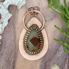 Puddingstone Pendant Front View - Stone Treasures by the Lake Rust Teardrop Handmade Jewelry, Artisan Bronze Teardrop Jewelry, Oval Jasper Cabochon Jewelry, Oval Cabochon Jasper Jewelry, Handmade Rose Gold Collectible Jewelry, Hand Forged Copper Oval Pendant Jewelry, Artisan Jasper Teardrop Jewelry, Bronze Cabochon Bohemian Jewelry, Handmade Bronze Oval Jewelry