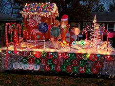 a christmas display with gingerbreads, candy canes and lights on the street