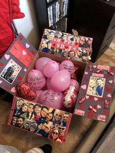 a box filled with pink balloons and pictures