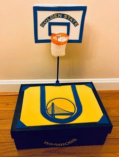 the golden state warriors basketball hoop is made out of cardboard and sits on top of a box