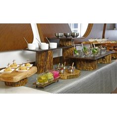 an assortment of food is displayed on a buffet table