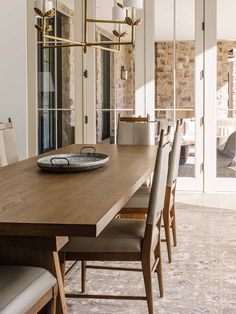 a dining room table with some chairs around it