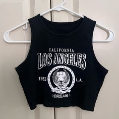 Shein Los Angeles Black Halter Racer Back Crop Top Nwot Size Xs Shein, Crop, Tops, Crop Top, Racerback, Halter, Halter Top, High Neck, Black, Black Crop Top, Tank, Brandy, Brandy Melville, Casual, Summer, Xs, Trendy, Nwot, Hem, La, Los Angeles, California, Ca, Cali Y2k Black Tank Top With Letter Print, Casual Graphic Print Tank Crop Top, Casual Tank Crop Top With Graphic Print, Casual Letter Print Tank Crop Top, Black Letter Print Crop Top For Summer, Trendy Black Tank Crop Top, Black Letter Print Tank Top For Spring, Trendy Black Tank Top, Casual Cropped Letter Print Tank Top