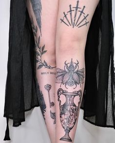 two tattoos on both legs that have flowers and vases on them, one is black and the other is white