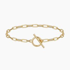 Indulge in timeless elegance with our 14K Gold Chain Bracelet for Women. Meticulously crafted, the delicate links create a refined and versatile accessory. This bracelet seamlessly transitions from casual to formal, adding a touch of sophistication to any ensemble. Elevate your style with the enduring allure of 14K gold, a symbol of both luxury and grace. Classic Adjustable Chain Bracelet With Oval Links, Formal Link Bracelets With Adjustable Chain, Formal Link Bracelet With Adjustable Chain, Classic Charm Bracelet With Cable Chain, Classic Metal Bracelets With Cable Chain, Classic Gold Bracelet With Toggle Clasp, Classic Bracelet With Toggle Clasp And Oval Link, Classic Gold-tone Bracelets With Toggle Clasp, Classic Gold Oval Link Bracelet With Adjustable Chain