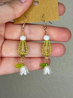 Plated mini hoop clasp earrings paired with beads and charms to emulate different types of flowers Spring Jewelry With Dangling Beads, Spring Dangle Jewelry With Dangling Beads, Garden Earrings, Clasp Earrings, Different Types Of Flowers, Types Of Flowers, Different Types, Flower Garden, Labour Day