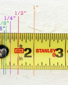 a measuring tape with the words stanley and 2 / 3 inches on it's side