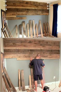 a man is working on some wood planks that are being built into the wall