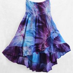 Fantastic Tie-Dye Ruffled Hi-Lo Skirt Can Also Be Worn As A Top! Brand New From Importer, Available In Small, Medium And Large. Beautiful Blues & Purples, Fun & Flirty And Extremely Comfortable. Light Weight, Soft And Flowy, 100% Rayon Fabric. Elastic Top Stretches To Fit Without Binding Or Rolling. Skirt Is About 21 Inches In Front To 33 Inches In Back. Gentle Wash, Drip Dry Recommended. Bohemian Purple Ruffled Skirt, Bohemian Purple Tiered Skirt, Bohemian Tiered Purple Skirt, Purple Flowy Skirt For Summer, Flowy Purple Skirt For Summer, Purple Long Skirt For Summer, Tie Dye Tiered Skirt For Summer, Blue Bohemian Skirted Dress, Bohemian Blue Skirted Dress