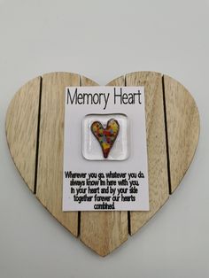 a wooden heart shaped magnet with a poem on it