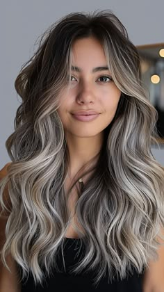 25 Silver Hair Color Concepts for a Cool, Confident Look Ash Icy Blonde Balayage, Dark On Top Blonde Underneath, Ash Gray Balayage With Highlights, Light Brown And Gray Hair, Silver Blonde Hair Balayage Dark Brown, Highlights Brown Hair Silver, Full Dimensional Color, Balayage Hair For Grey Roots, Ash Hair Ideas