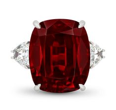 This glamorous ring showcases an incomparable brilliant-cut spinel that weighs a monumental 33.10 carats. The stone, which is certified by GemResearch Swisslabs, is entirely untreated, meaning its deep crimson color is nature-made. The spinel is flanked by two white diamonds weighing 2.27 carats, and all three gems are classically set in platinum. Though often mistaken for rubies or sapphires, spinels have experienced a surge in popularity in recent years due to their remarkable range of color a Golconda Diamond, Red Diamond Ring, Crimson Color, Red Diamonds, Spinel Jewelry, Spinel Ring, Jewels Rings, Golden Ring, Red Diamond