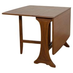 a small wooden table with one leg bent down and the other turned upside down, on an isolated white background