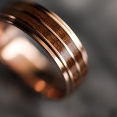 a wedding ring with wooden inlays on it