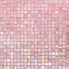 a close up view of a pink and white mosaic tile wall with lots of small squares