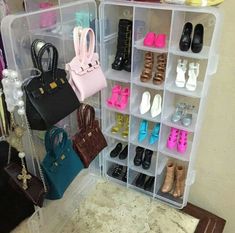 a closet filled with lots of different types of shoes and handbags hanging on the wall