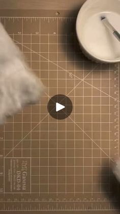 a video demonstrating how to use a cutting mat with scissors and paper towels on it