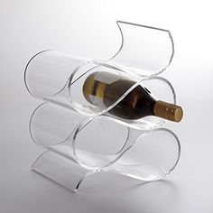 a wine bottle holder made out of clear acrylic