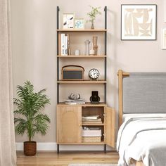 a bed room with a neatly made bed and a book shelf next to the bed