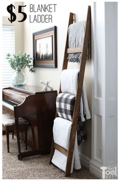 a ladder leaning up against a wall with towels on it and a piano in the corner