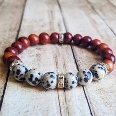 Bracelet Made With 8mm Dalmatian Jasper Stone Beads, Wooden Beads, And Silver Rhinestone Spacer Beads On Elastic Cording. Dalmatian Beaded Bracelet, Dalmatian Jasper Jewelry, Dalmatian Jasper Bracelet, Jasper Bead Bracelet, Knot Jewelry, Jasper Jewelry, Jewelry Knots, Wood Bracelet, Dalmatian Jasper