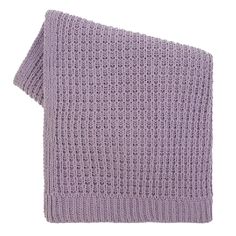 a purple knitted blanket on a white background