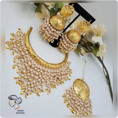 DETAILS:- kirat gold plated hasli set Very fine quality, handmade gold plated set Comes with Statement jhumkis and tikka Extremely lightweight JJhumka length:- 3.4 inches Gold Meenakari Chandbali Jewelry Sets, Gold Chandbali Jewelry Sets, Festive Gold Kundan Sets, Gold Bridal Sets With Chandbali Latkans, Gold Hand-set Chandbali Jhumkas, Ceremonial Chandbali Kundan Necklace In Gold Plated, Gold Chandbali Jhumkas Hand Set, Ceremonial Gold Plated Chandbali Kundan Necklace, Bollywood Style Gold Lehenga With Meenakari