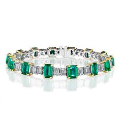 Timeless luxury bracelet with 14 natural deep green emeralds. These emeralds shine and are accentuated by 28 white diamonds, all GIA certified. The 18-carat yellow gold prongs secure the green emeralds. A masterpiece weighing 24.15 carats. Luxury Green Brilliant Cut Diamond Bracelet, Luxury Green Tennis Bracelet, Luxury Emerald Cut Green Diamond Bracelet, Luxury Green Emerald Diamond Bracelet, Luxury Green Emerald Bracelets, Luxury Yellow Gold Emerald Tennis Bracelet, Green Brilliant Cut Diamond Bracelet, Green Brilliant Cut Diamond Bracelet Fine Jewelry, Green Brilliant Cut Diamond Bracelet In Fine Jewelry Style