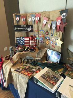 a table topped with books and pictures on top of it