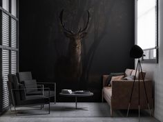 a living room filled with furniture and a deer wall mural