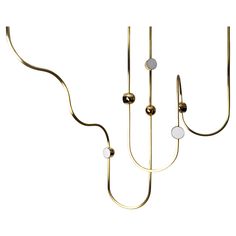 three brass - plated lights hang from the ceiling