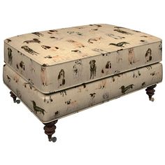 an upholstered footstool with horses on it