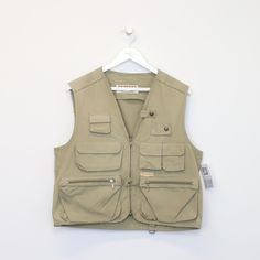 SKU - DM5273  Vintage Chaser vest in brown. Best fits L DETAILS:  ▫️ Front pockets ▫️ Zip up   👕 Fits like a ~ L ▫️ Label states ~ L ▫️ Pit to Pit ~ 21.5" ▫️ Length ~ 21.5" ▫️ Pit to Cuff ~ N/A   👇 If any defect is found and it is not included in the provided photos, it will be listed below. ▫️ Front speck stains     🧺 All items are professionally washed and ironed before photos are taken and then sold.    ✅ If the item is listed, it is available    ❌ Disclaimer: Like all vintage items they m Favorite Outfit, Mens Jackets, Zip Ups, Vintage Items, Bathing Beauties, Im Not Perfect, Jackets & Coats, Display Homes, Cafe