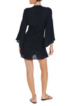 Move from beach to cocktails in this breezy cover-up designed with a gathered and twisted front for stylish definition. V-neck Long sleeves Lined 100% cotton Hand wash, dry flat Made in Brazil Latinx Owned/Founded Spring V-neck Swim Dress For Beachwear, Chic V-neck Beach Dress For Poolside, Flowy Black Summer Cover-up, Spring V-neck Swim Dress For Beach Cover-up, V-neck Beachwear Cover-up For Day Out, Chic V-neck Beach Party Cover-up, Unlined V-neck Cover-up For Vacation, Black V-neck Beach Dress For Poolside, Long Sleeve Swim Dress For Summer Vacation