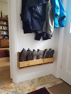 there is a coat rack with shoes on it