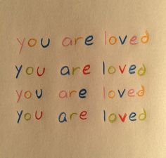 the words you are loved and you are loved written in colored crayons on white paper