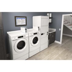 a laundry room with washers and dryers in it